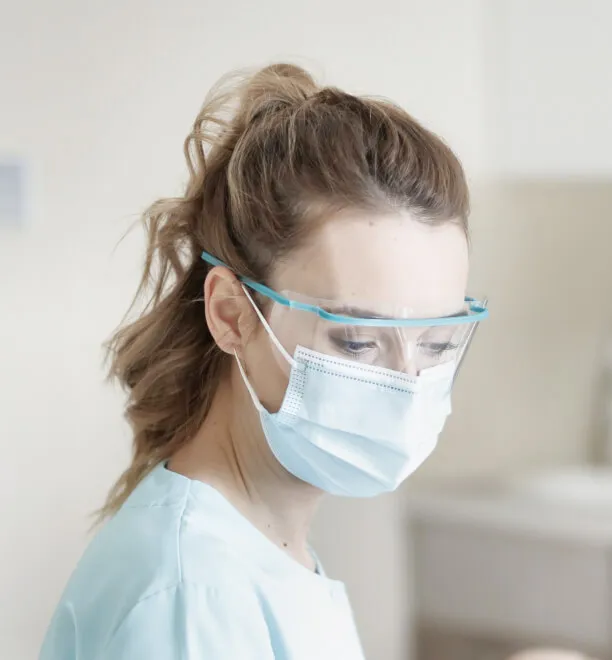 Hello Dental dentist during a teeth whitening procedure 