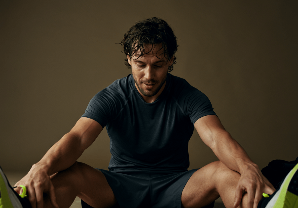 Man Stretching on Floor