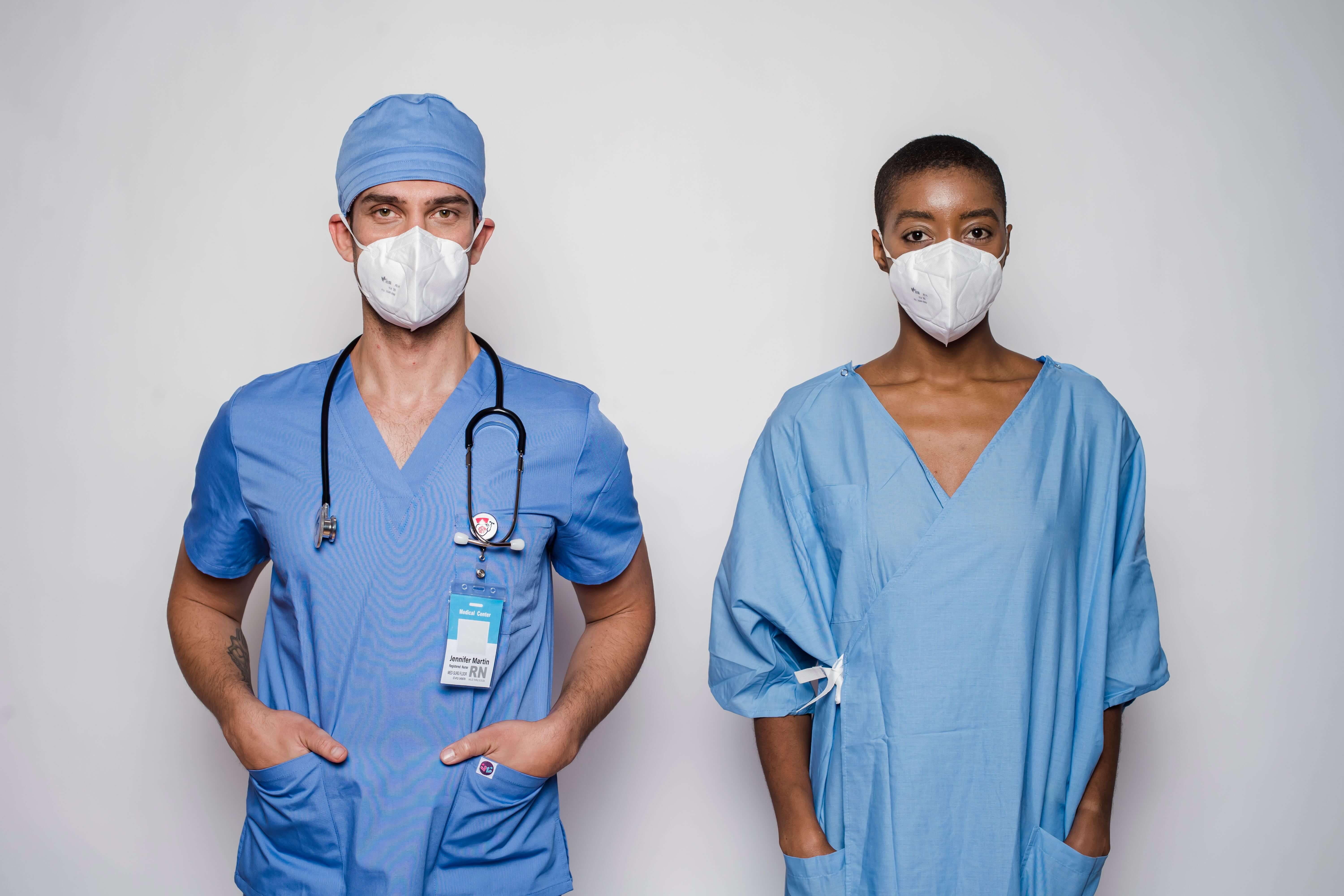Two registered nurses standing next to each other