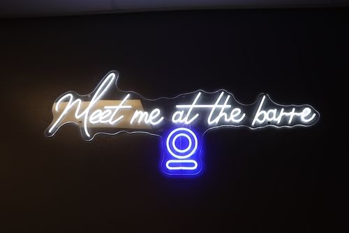 Neon sign that reads Meet me at the barre