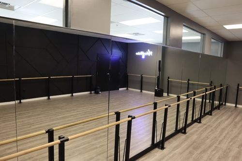 Inside studio Barre room with mirrored wall