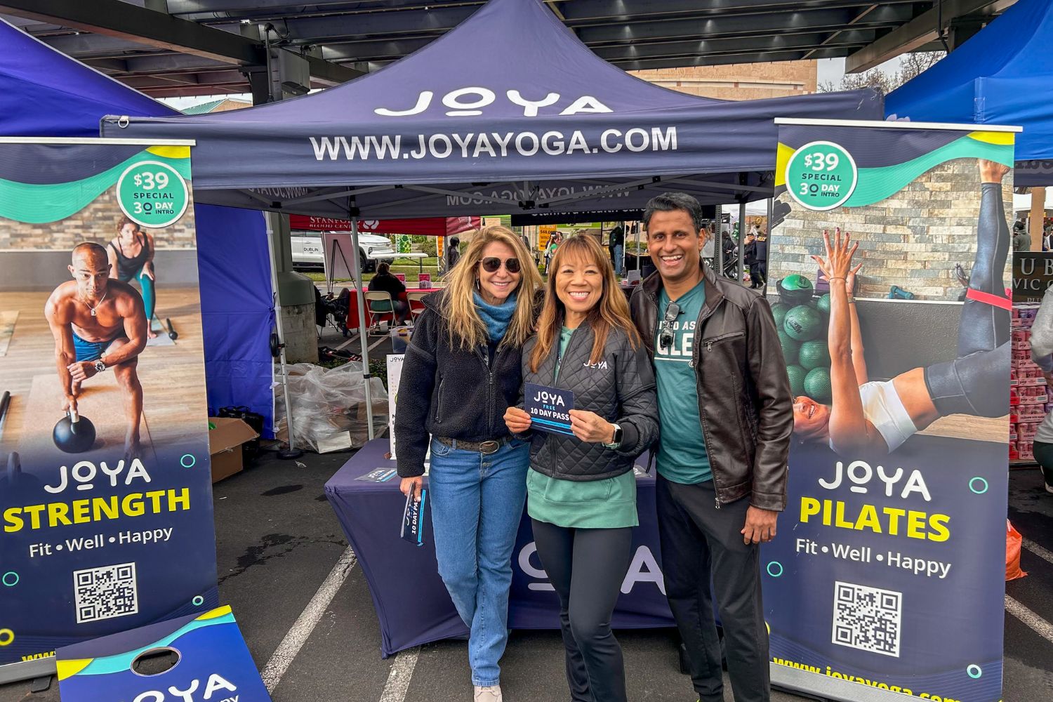 Yoga instructors at an event booth