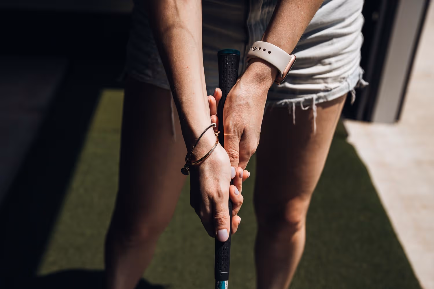 Female Person holding a golf grip at Pod Golf at Northshore in North Little Rock, AR