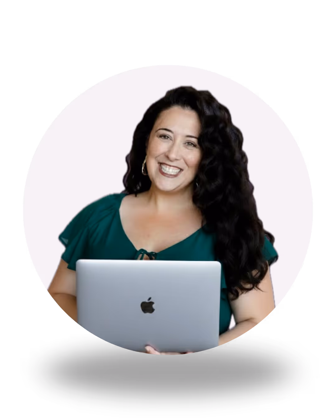 Lizzy Moffett, smiling while holding a coffee mug, seated at a wooden table — web designer and Website Operations Director