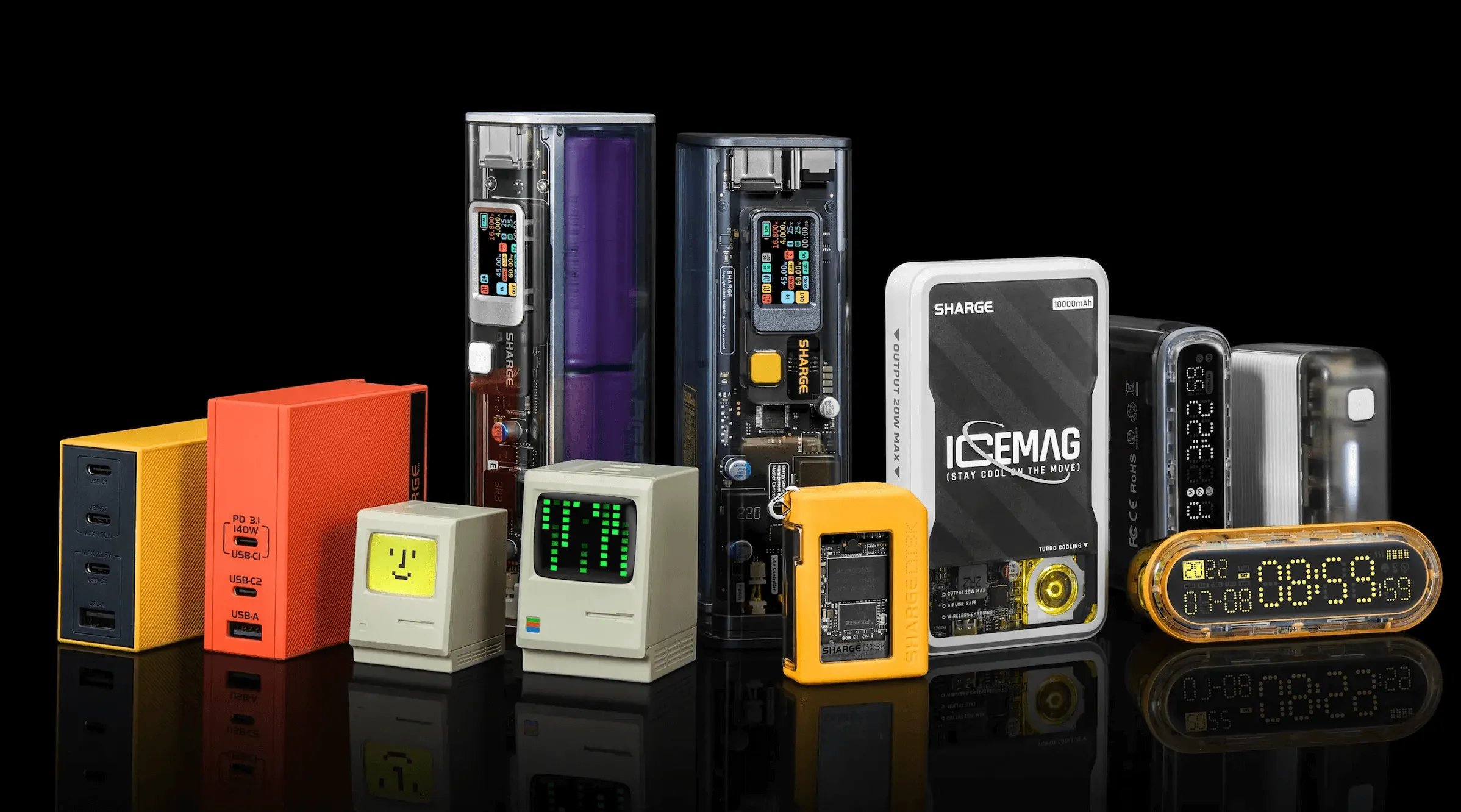 Array of colorful compact electronic devices including charging units and digital clocks with retro design on a reflective black surface.