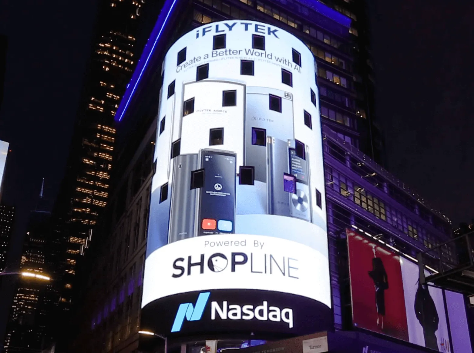 Large curved digital billboard at night displaying iFLYTEK branding, smartphones, Powered by SHOPLINE text, and Nasdaq logo on a building corner.
