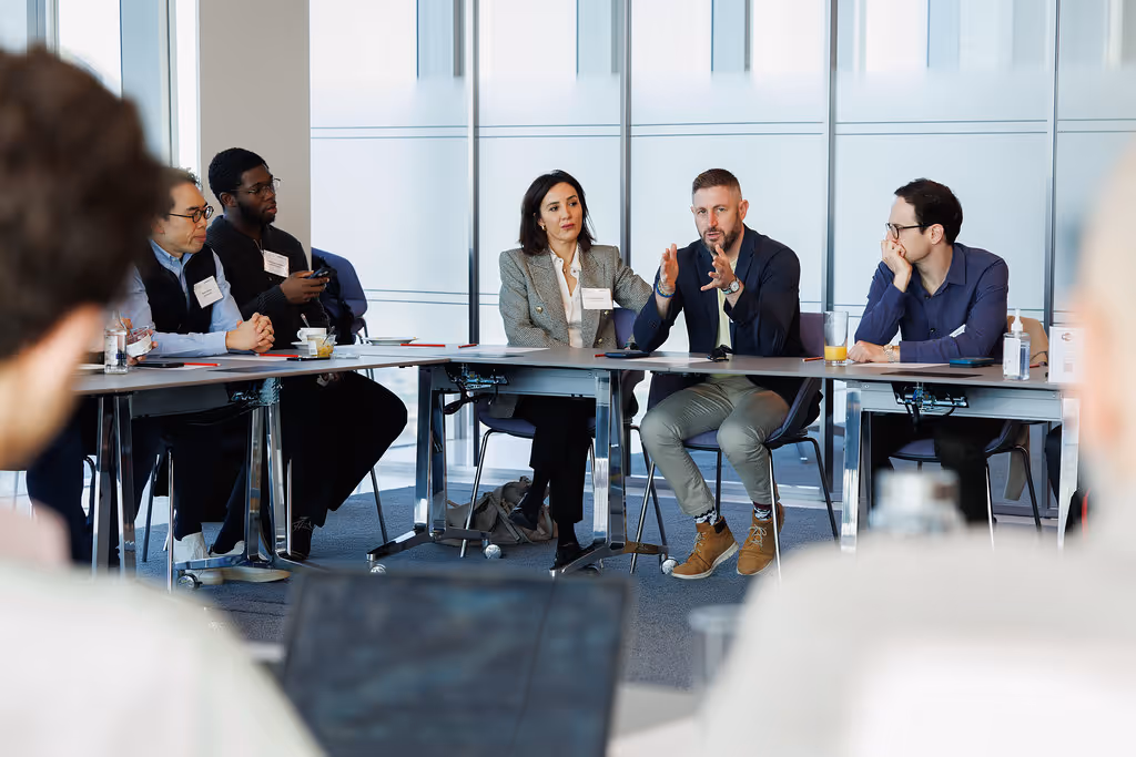 Roundtable discussion with venture capital investors and entrepreneurs exchanging insights on funding, innovation, and growth strategies.