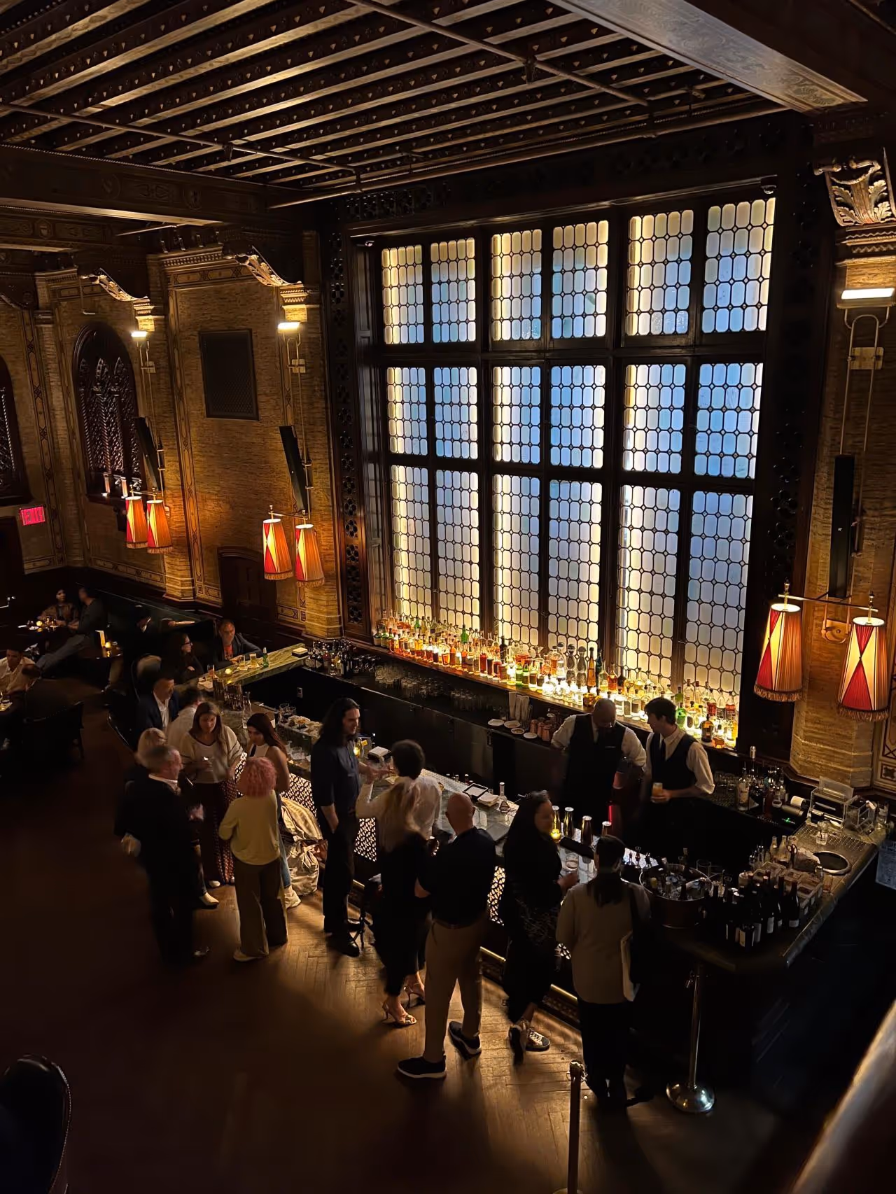 Venture capital networking dinner in an upscale venue, with investors and entrepreneurs connecting over drinks in an elegant setting.