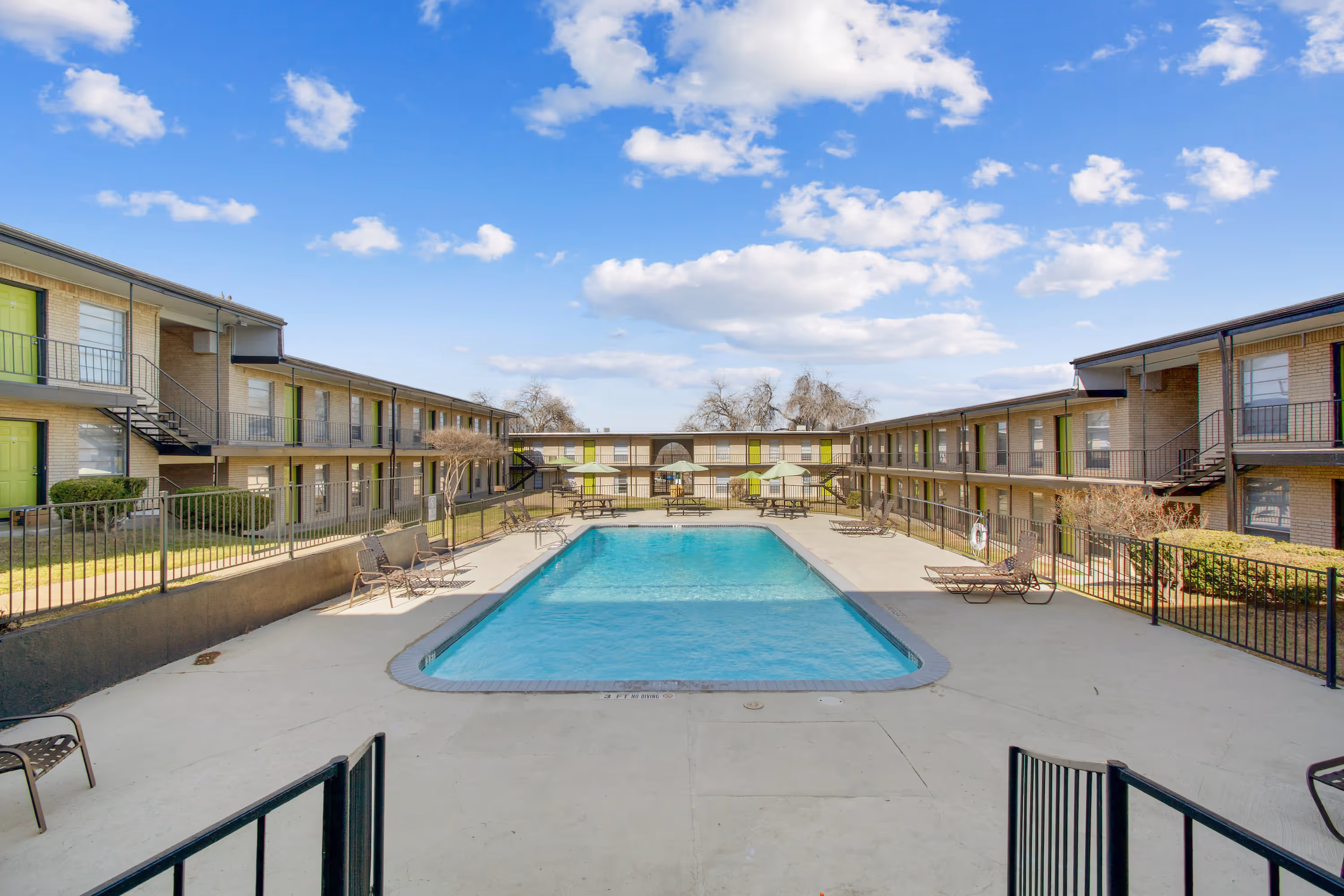 swimming pool with lounge chairs