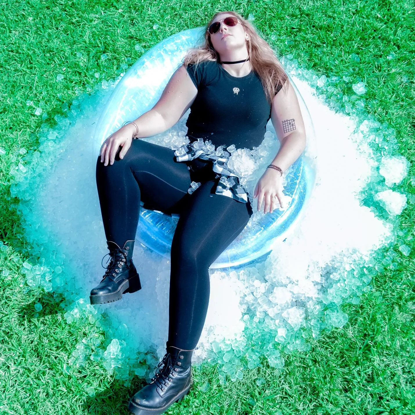 A person sitting on a surfboardDescription automatically generated with medium confidence