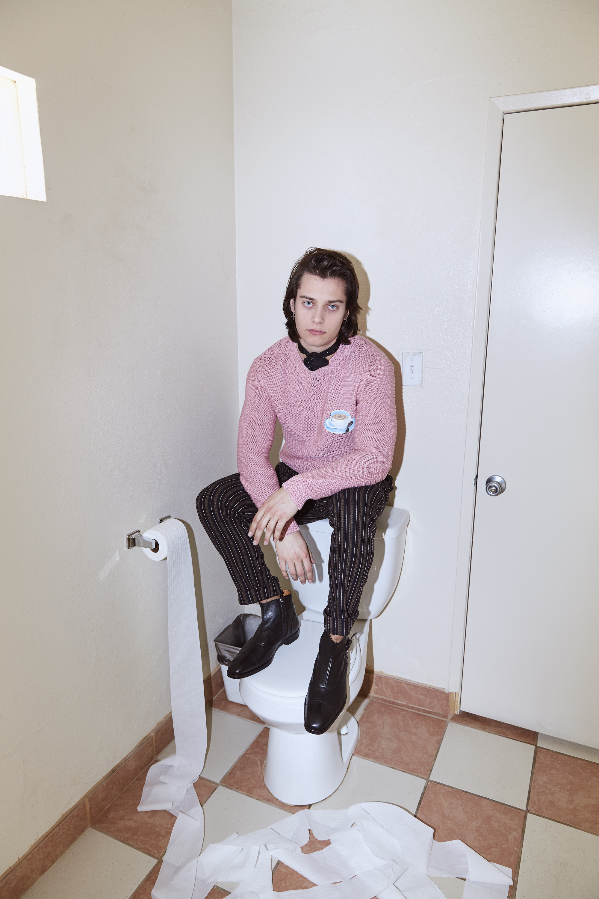 Mark wears FENDI sweater, ETRO pants, and BRUNO MAGLI shoes.