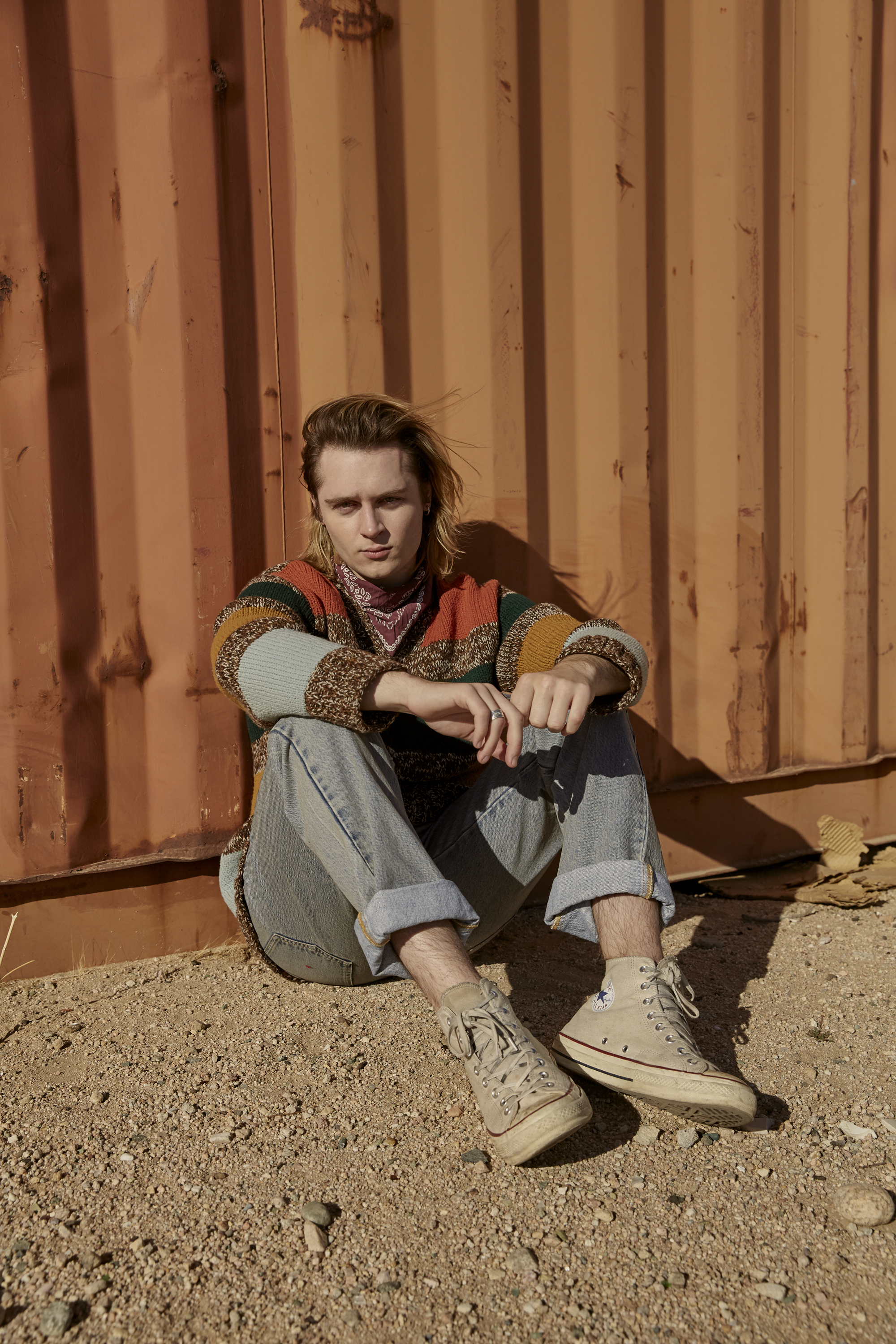 GUCCI sweater and jeans, LEVI’S bandana, and CONVERSE shoes.