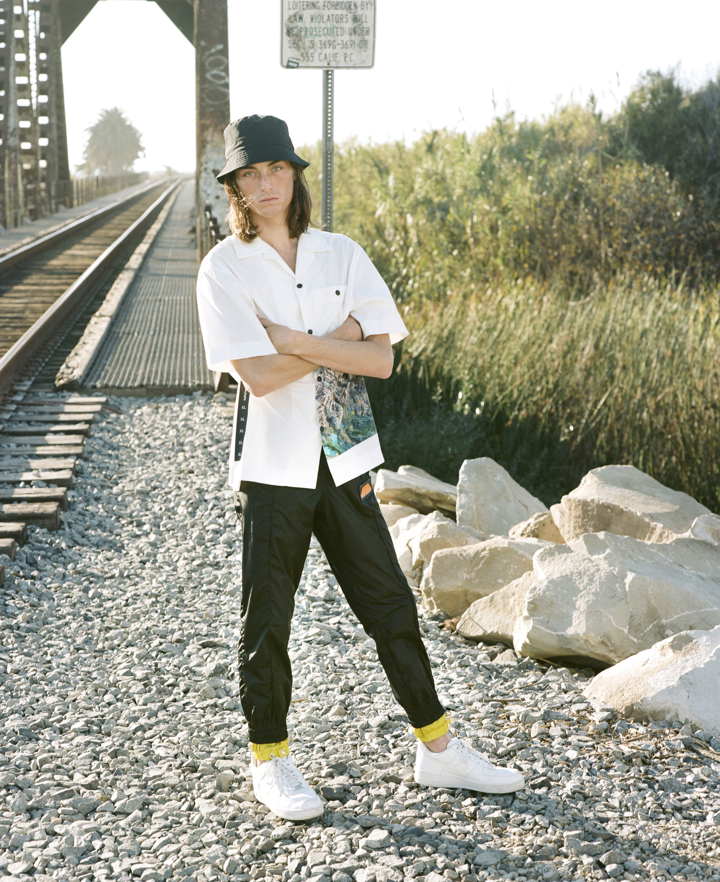 PALM ANGELS shirt and pants, NIKE shoes, and BARACUTA hat