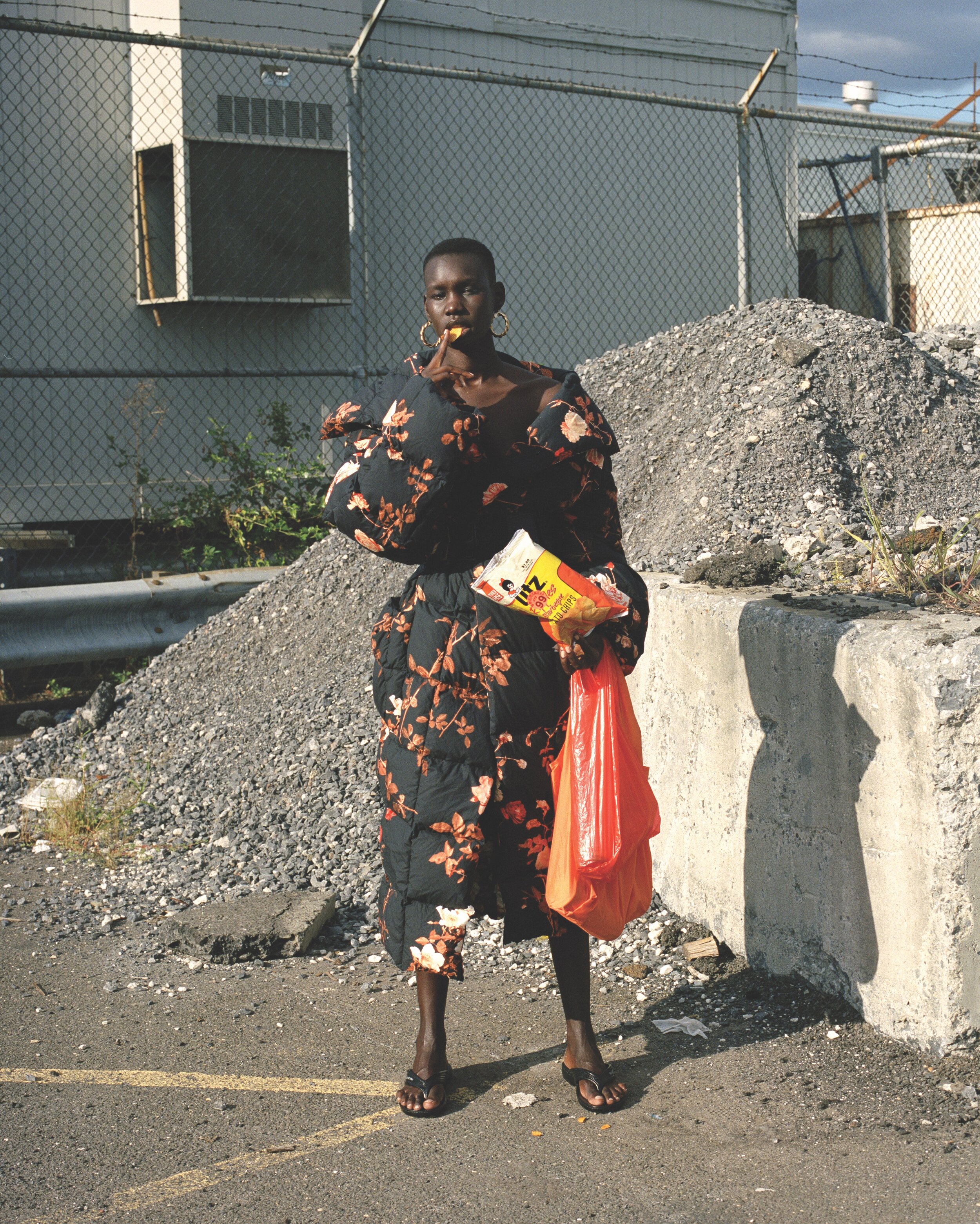 DRIES VAN NOTEN coat, DIOR belt, HAVE A GOOD TIME sandals, and MACHETE earrings.