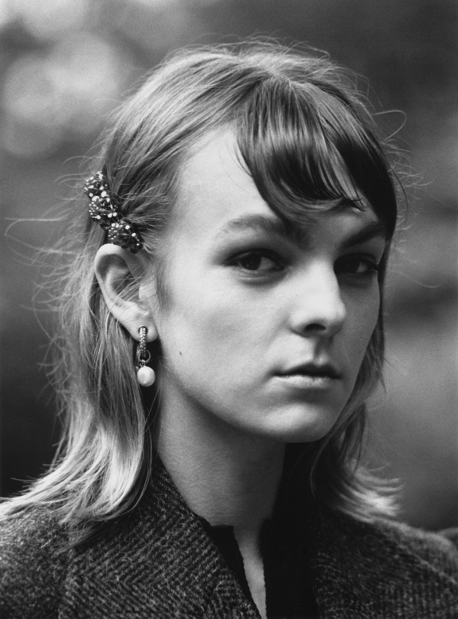 MAISON MARGIELA coat, DIOR earrings, and SIMONE ROCHA hair clip.