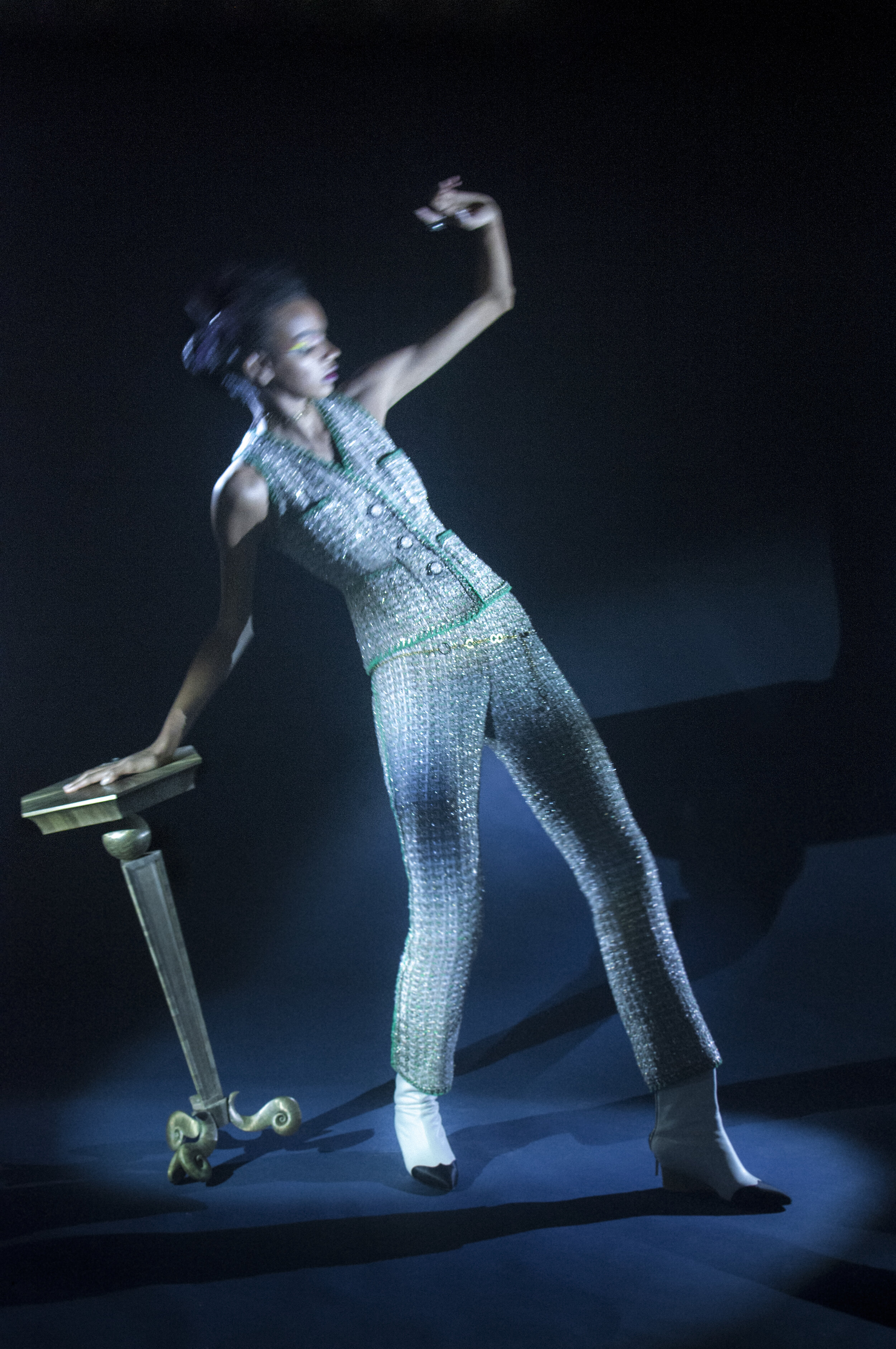 CHANEL HAUTE COUTURE green, white, gold, silver, pink and orange tweed vest with braiding detail on the neckline, armholes, and the top of the pocket and straight pants with braid appliqued on the exterior side seams. Belt exterior and interior in g…