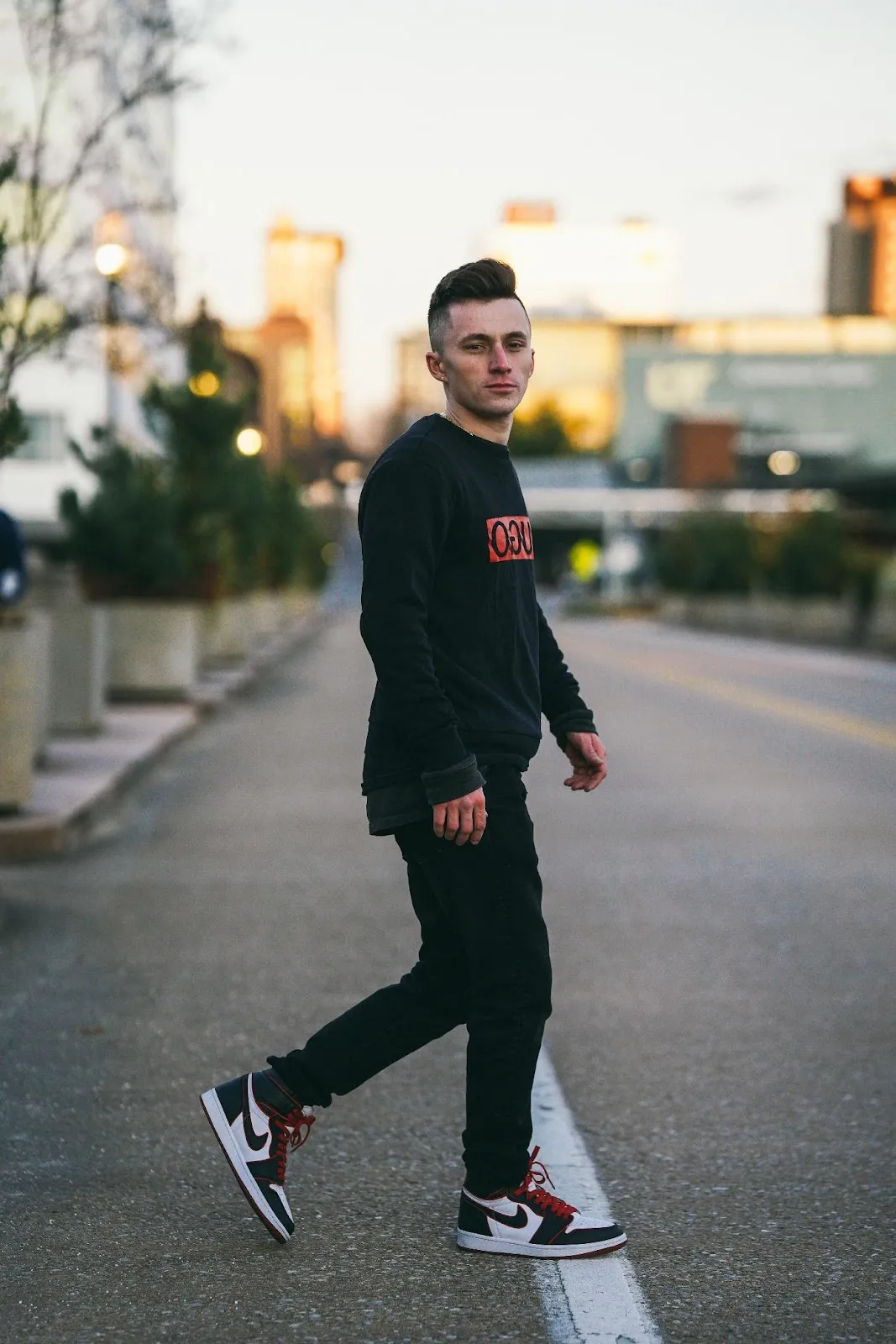 A person walking on a streetDescription automatically generated with medium confidence
