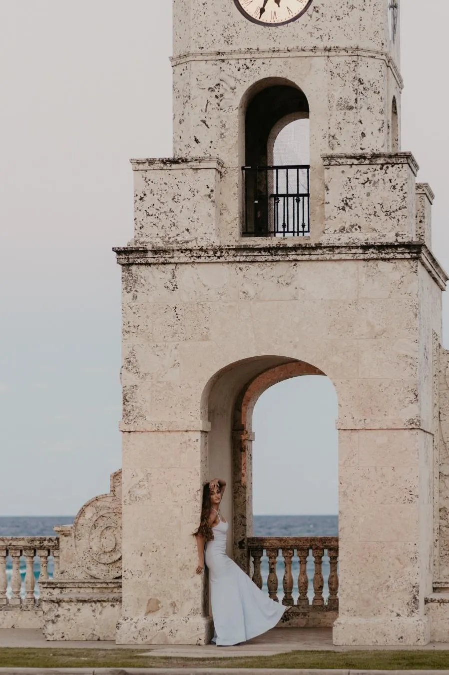 A bride and groom standing in a towerDescription automatically generated