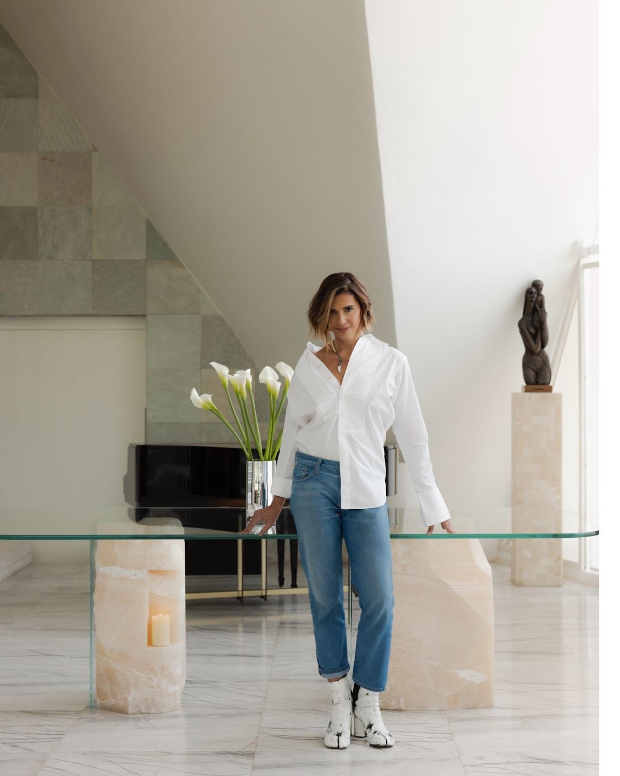 A person standing on a glass tableAI-generated content may be incorrect.