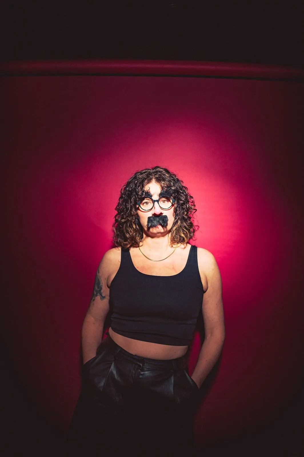 A person with a mustache and glassesAI-generated content may be incorrect.