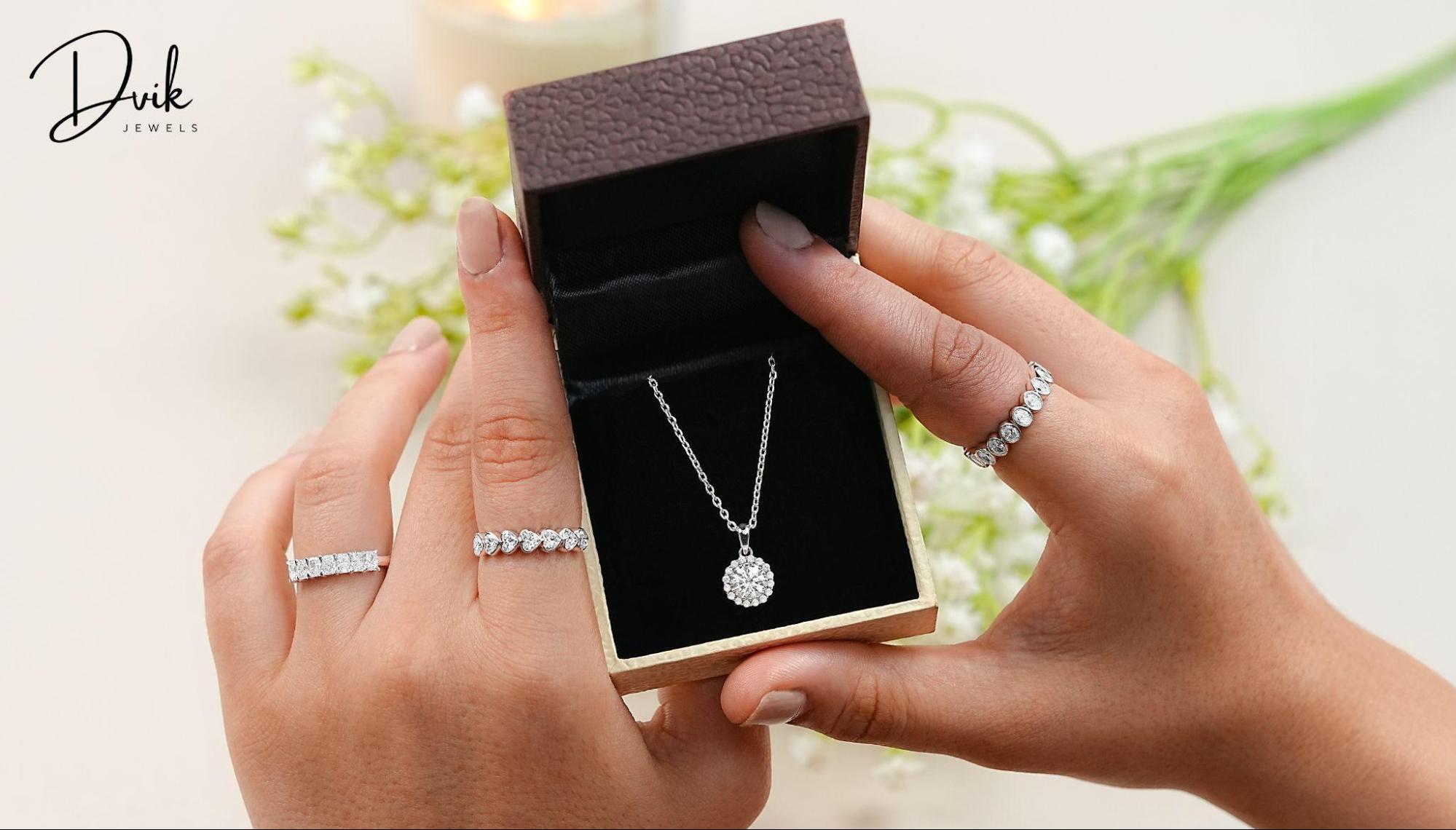 lab grown diamond eternity rings and a halo pendant in a box from Dvik Jewels