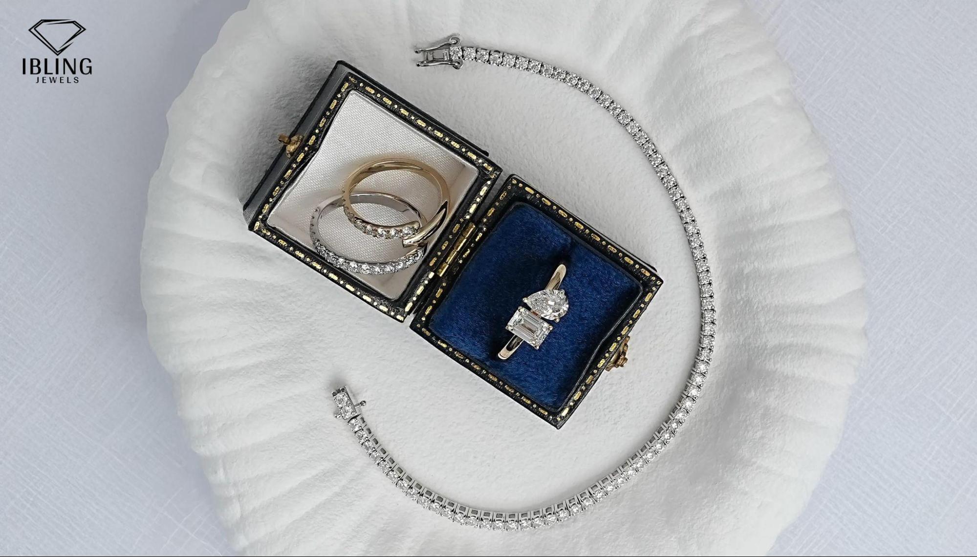 lab diamond eternity, bypass, and toi et moi rings, alongside a tennis bracelet from Ibling Jewels