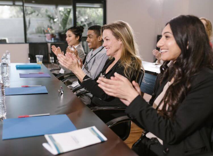 audience showing engagement to the speaker through clapping