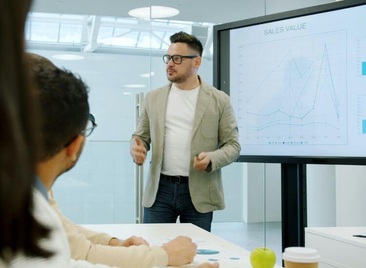 Professional presenting analytical data charts during an informative speech