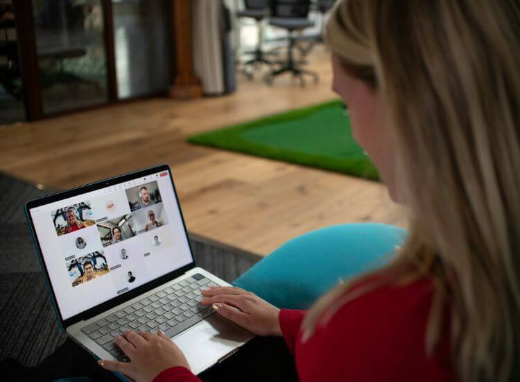 attending a webinar showing the attendees on the computer screen