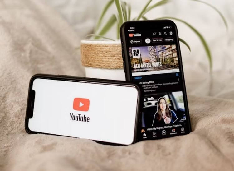 (YouTube platform and logo showing on mobile phones