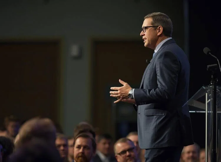 a confident speaker on stage