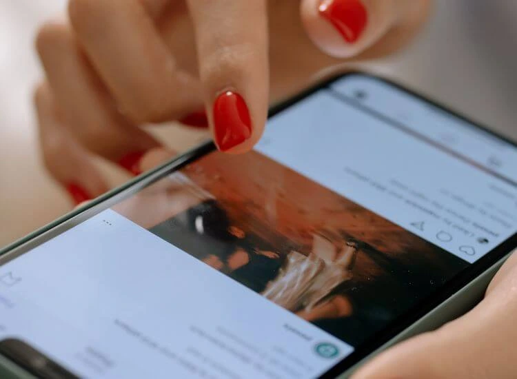 scrolling on smartphone showing an Instagram post