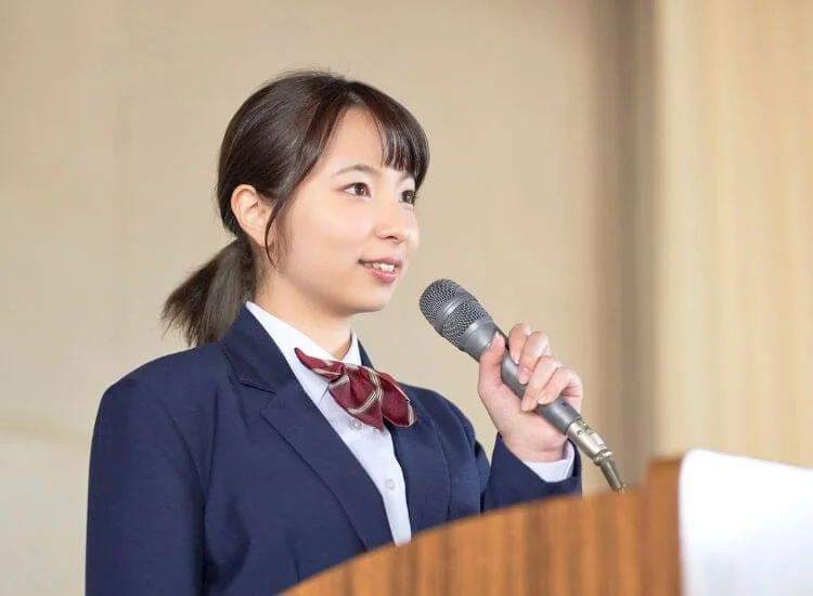 a student deliver her keynote speech