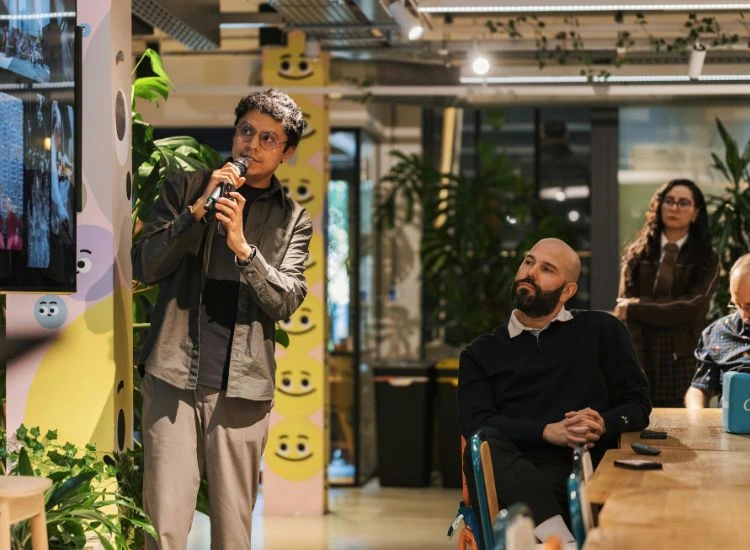 a speaker reading from the slides while presenting