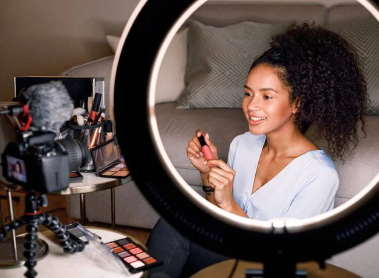 content creator using a ring light for video creation