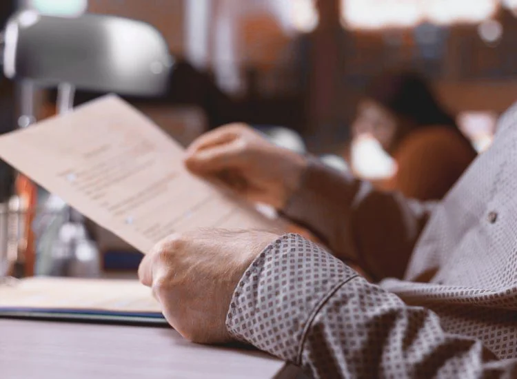 holding and reading a script