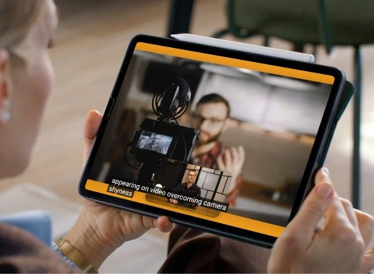 watching on a tablet a video with captions for video accessibility