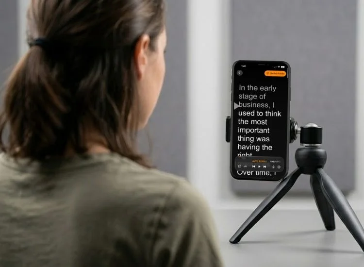 Teleprompter app scrolling script text on a phone screen with the camera