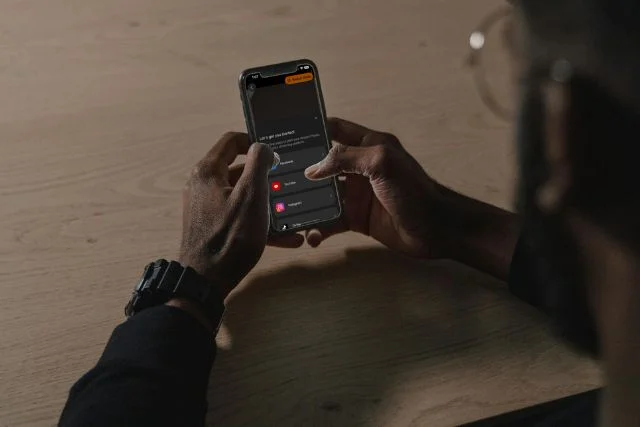 smartphone screen displaying teleprompter app option for live streaming platforms