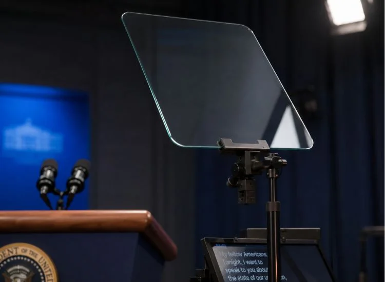 Presidential teleprompter setup showing angled glass panel and monitor