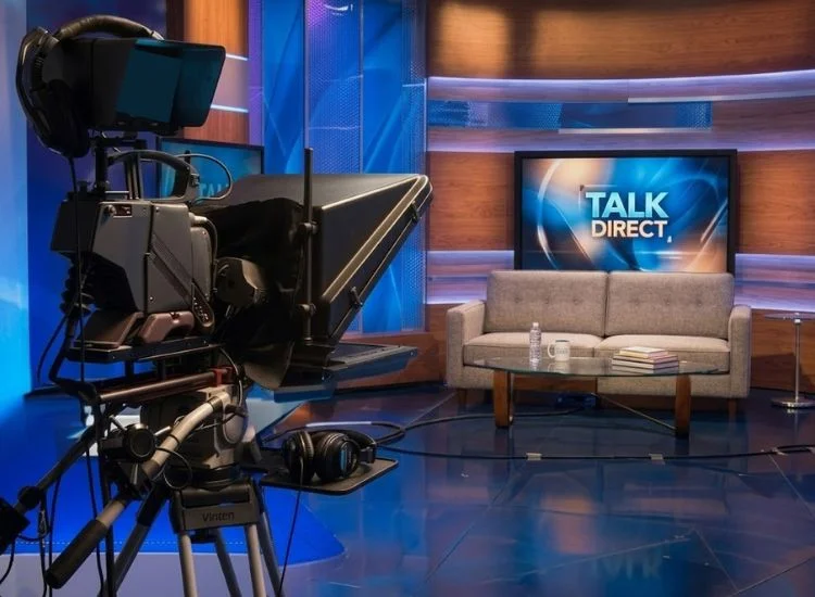 Teleprompter mounted on a professional camera for an in-person TV interview