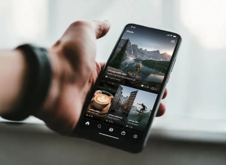 Holding a smartphone showing Instagram Reels