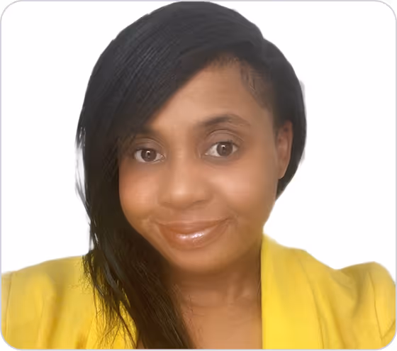 Portrait of a woman with dark hair wearing a yellow top smiling against a white background.