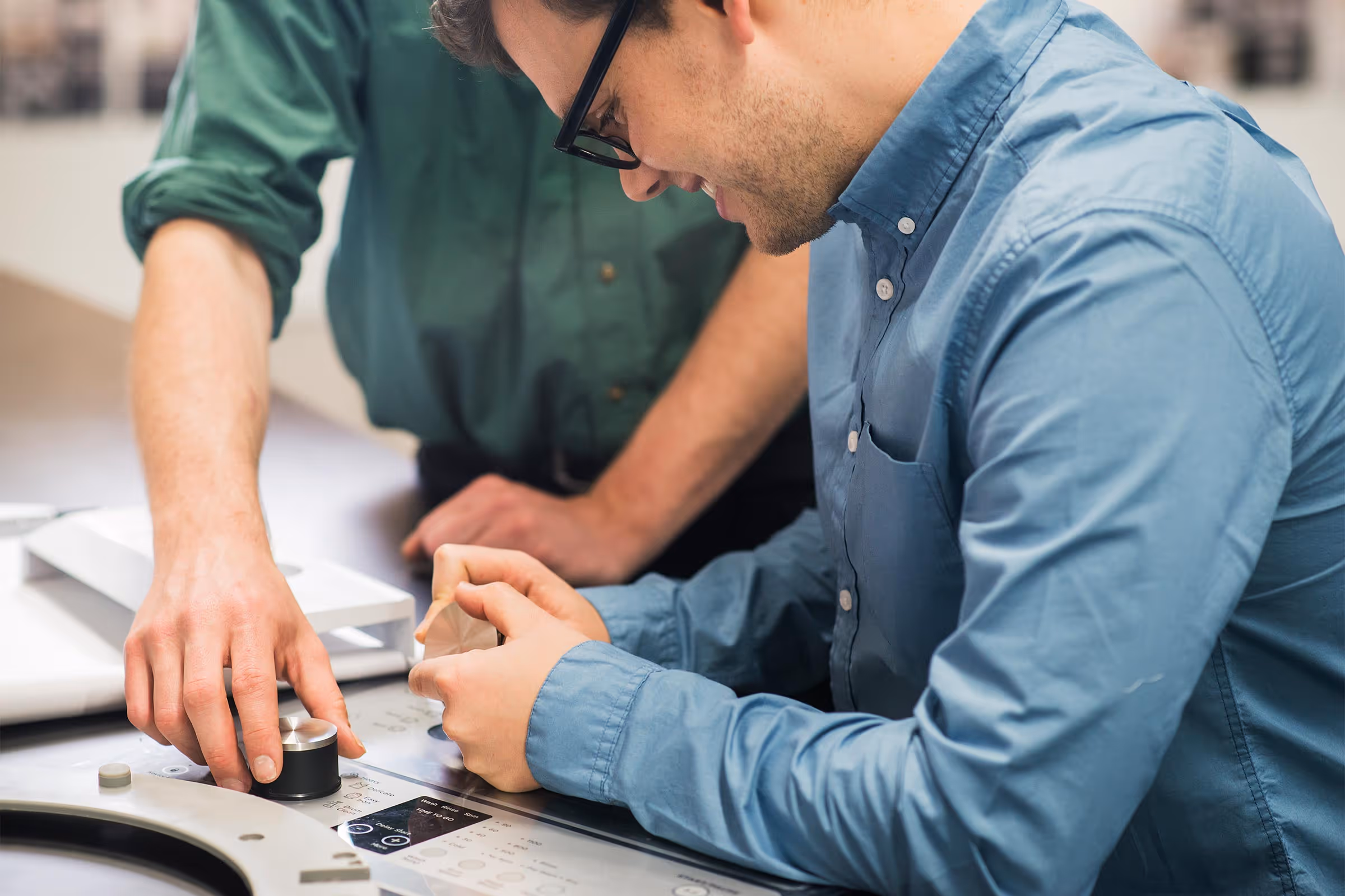 Two men working on a healthtech prototype