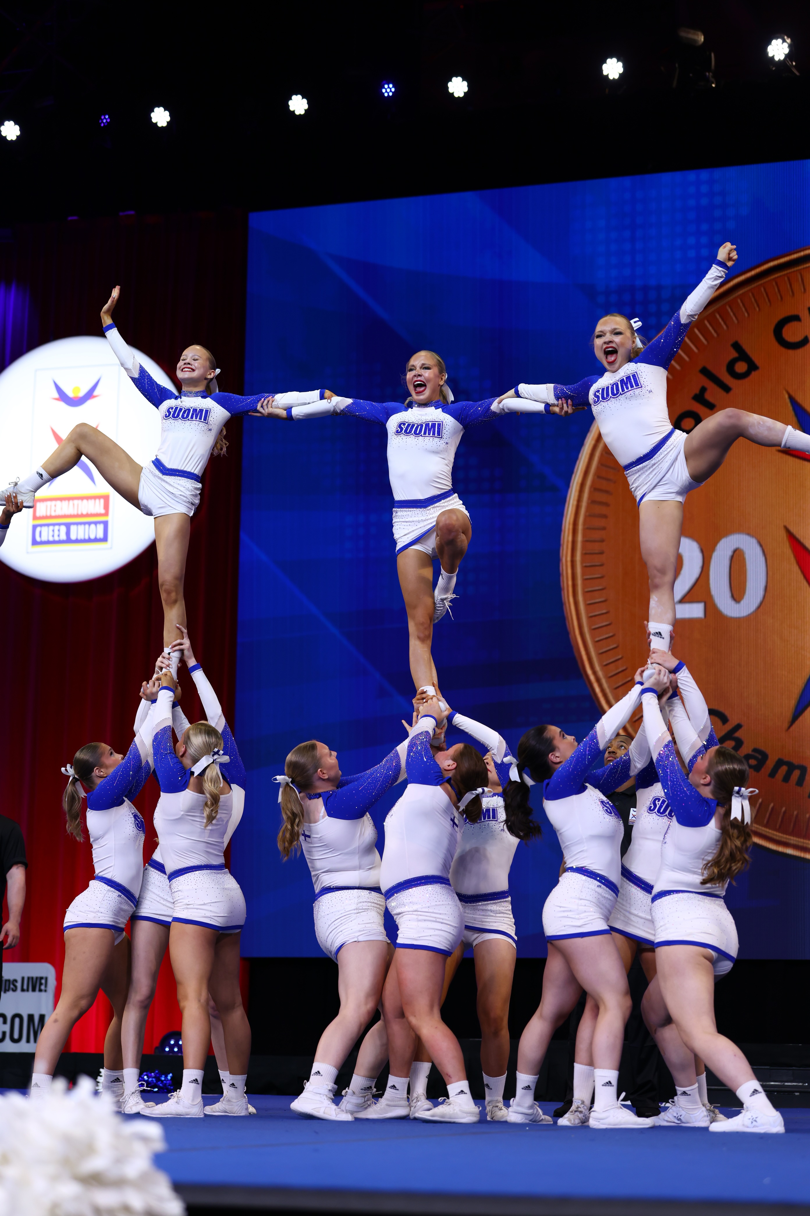 Finland’s junior national cheerleading team practicing a technically challenging program with high-quality coaching, aiming for world championship success.