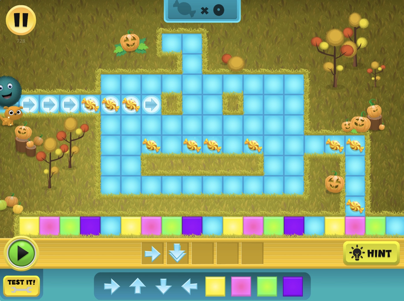 A pumpkin patch coding maze in Kodable Basics with arrow commands and candy to collect