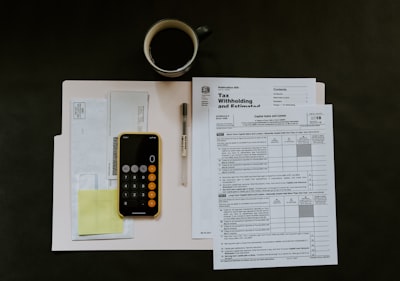 Picture of paperwork going through taxes.