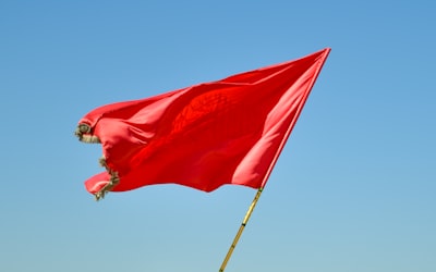 Red flag blowing in the wind.