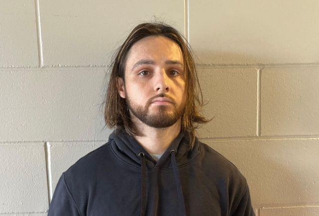 Image on white brick of Jonathan Rinderknecht.