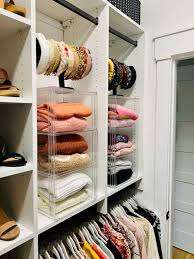 Clear bins for clothing in closet. 